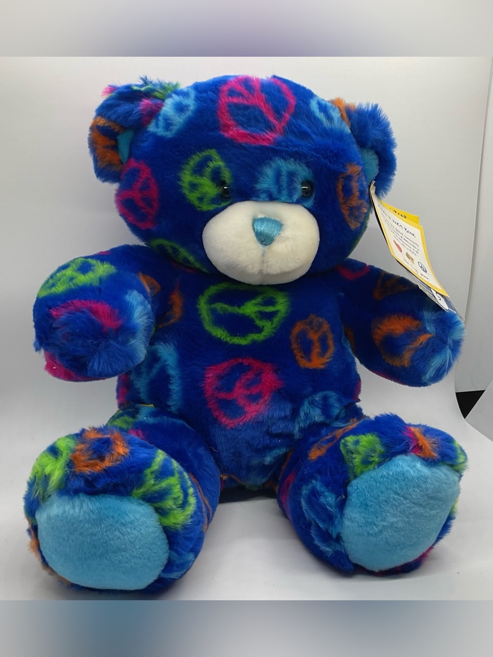Build-A-Bear Royal Blue Plush Teddy with Multicolor Peace Signs